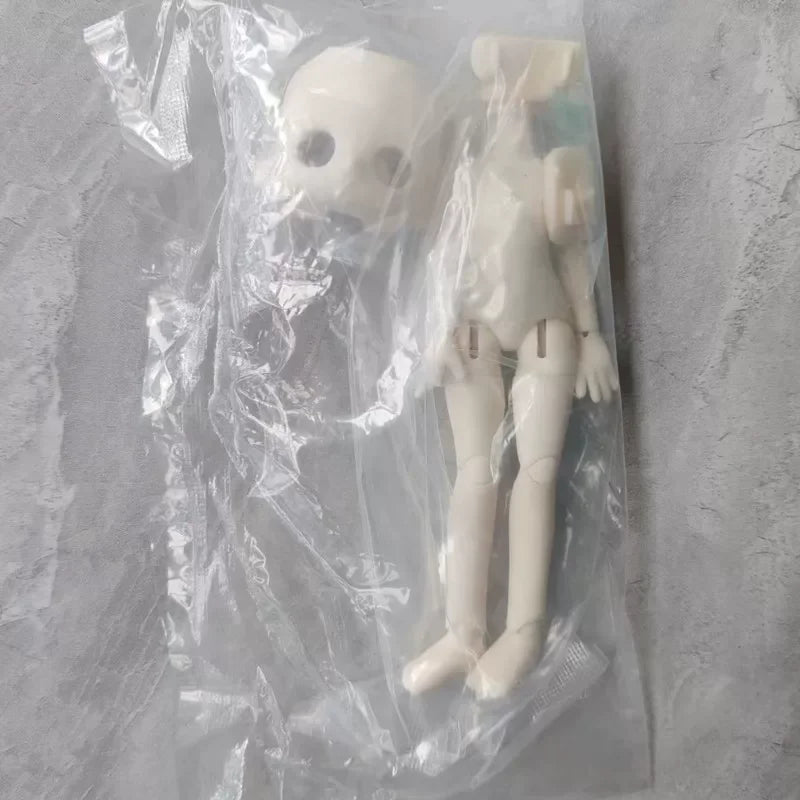 A white articulated BJD collectible figurine in a clear plastic blind box packaging.