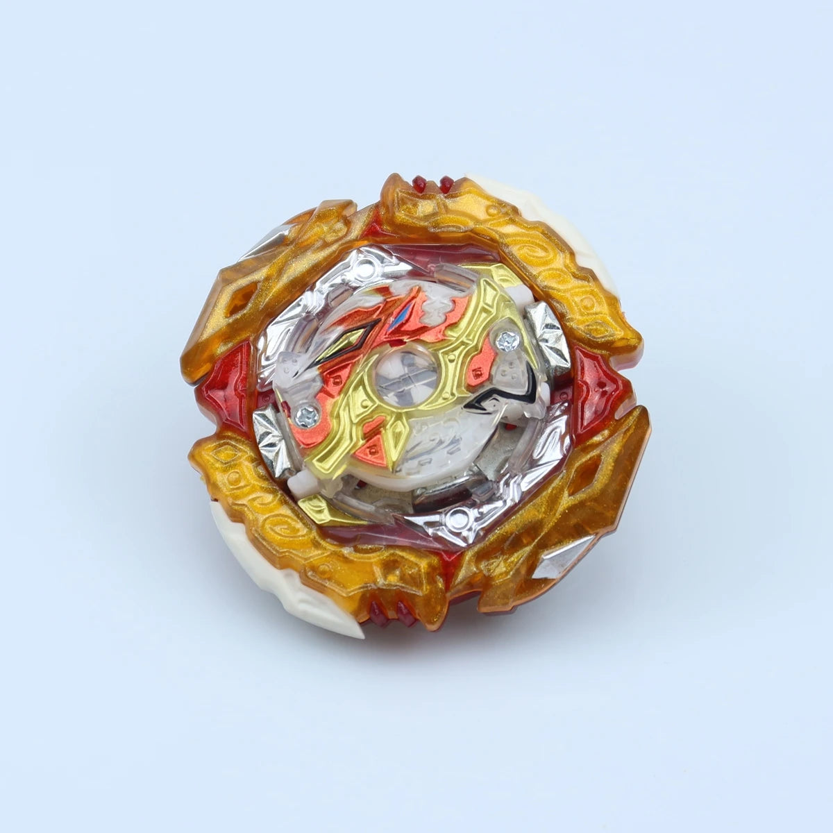 A metal battle spinning top featuring gold and red accents with a central white sphere.