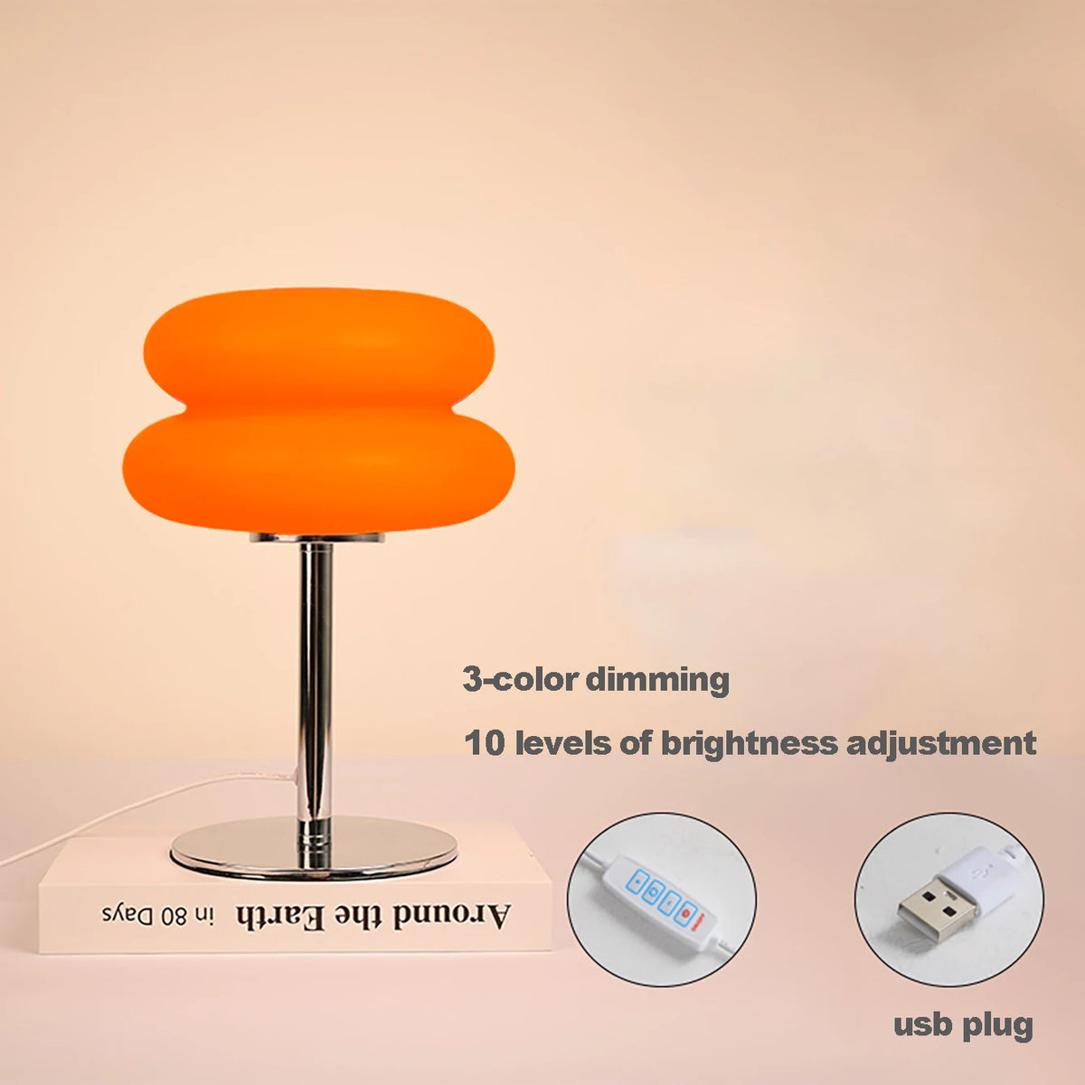 Orange cloud-shaped bedside lamp with a silver stand and USB plug for dimming.
