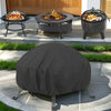A black round fire pit cover is placed on a patio, with a fire pit and a grill visible in the background.