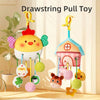 A yellow cartoon pendant toy featuring a house shape and various hanging rattles and teethers.