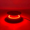 A round red LED strobe light mounted on a base, glowing brightly against a dark red background.
