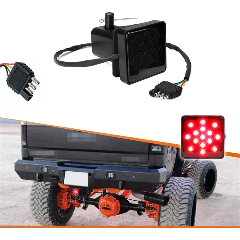 A black universal 12V LED trailer tail light with brake and running functions mounted on a vehicle.