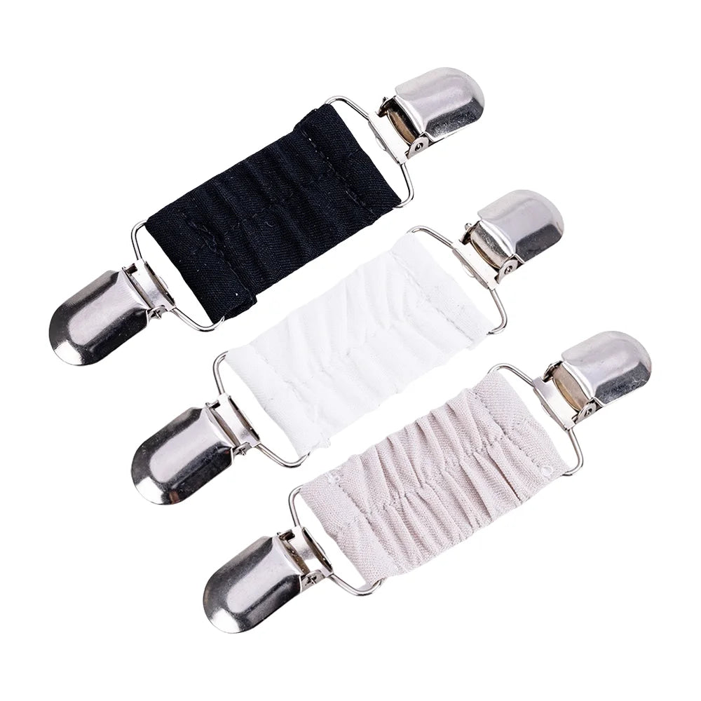 Pinces réglables argent et noir avec sangles élastiques pour serrer des vêtements comme les pulls ou les châles