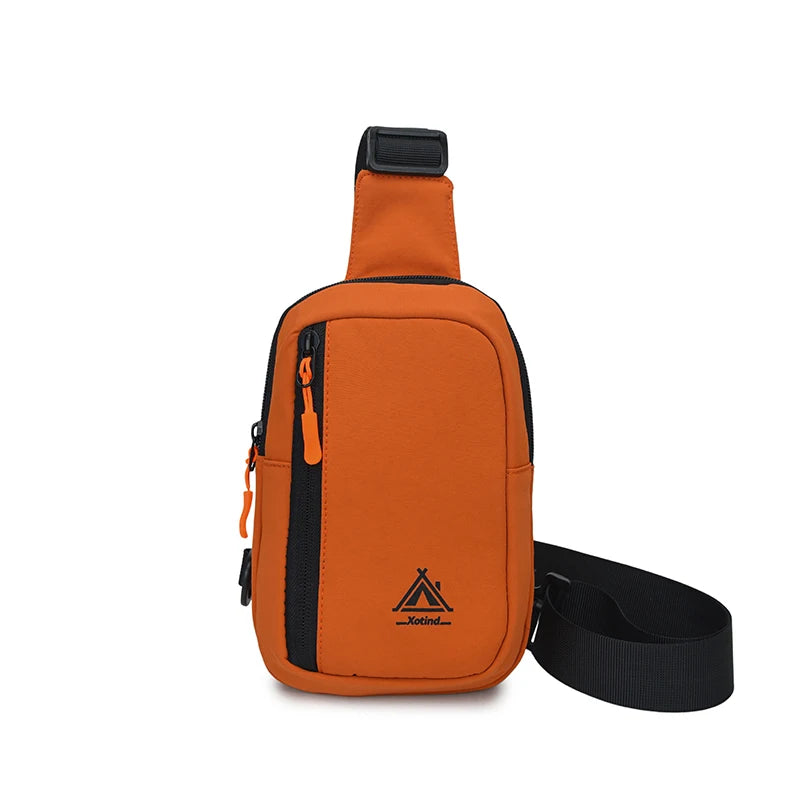 An orange water-resistant nylon chest sling bag with a black strap and zipper visible from the top.