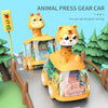 A yellow animal press gear car toy featuring a tiger design, moving on a track.