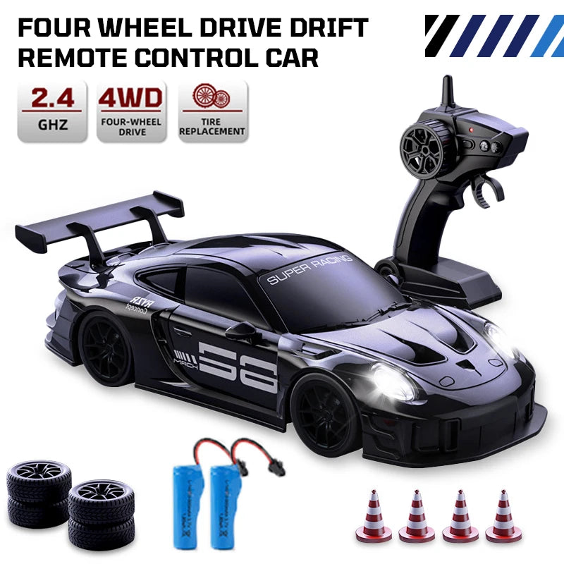 A black four-wheel drive drift remote control car with accessories and tire replacement parts.