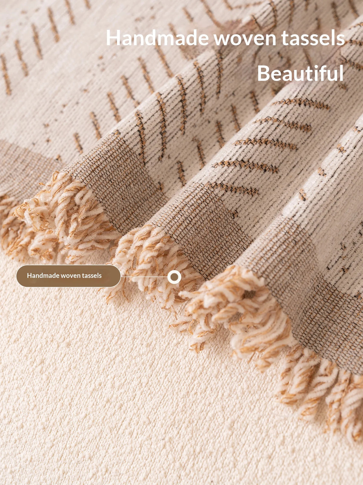 Close-up of a beige woven fabric sofa cover featuring handmade woven tassels and a fishbone pattern.