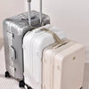 A silver and cream adjustable luggage set featuring a hard-shell suitcase and an accompanying strap.