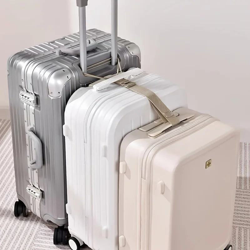 A silver and cream adjustable luggage set featuring a hard-shell suitcase and an accompanying strap.