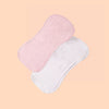 A pair of pink and white multi-use baby burp cloths are shown against a light peach background.