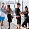 Four people exercising outdoors wearing water-resistant nylon fanny packs and athletic clothing.