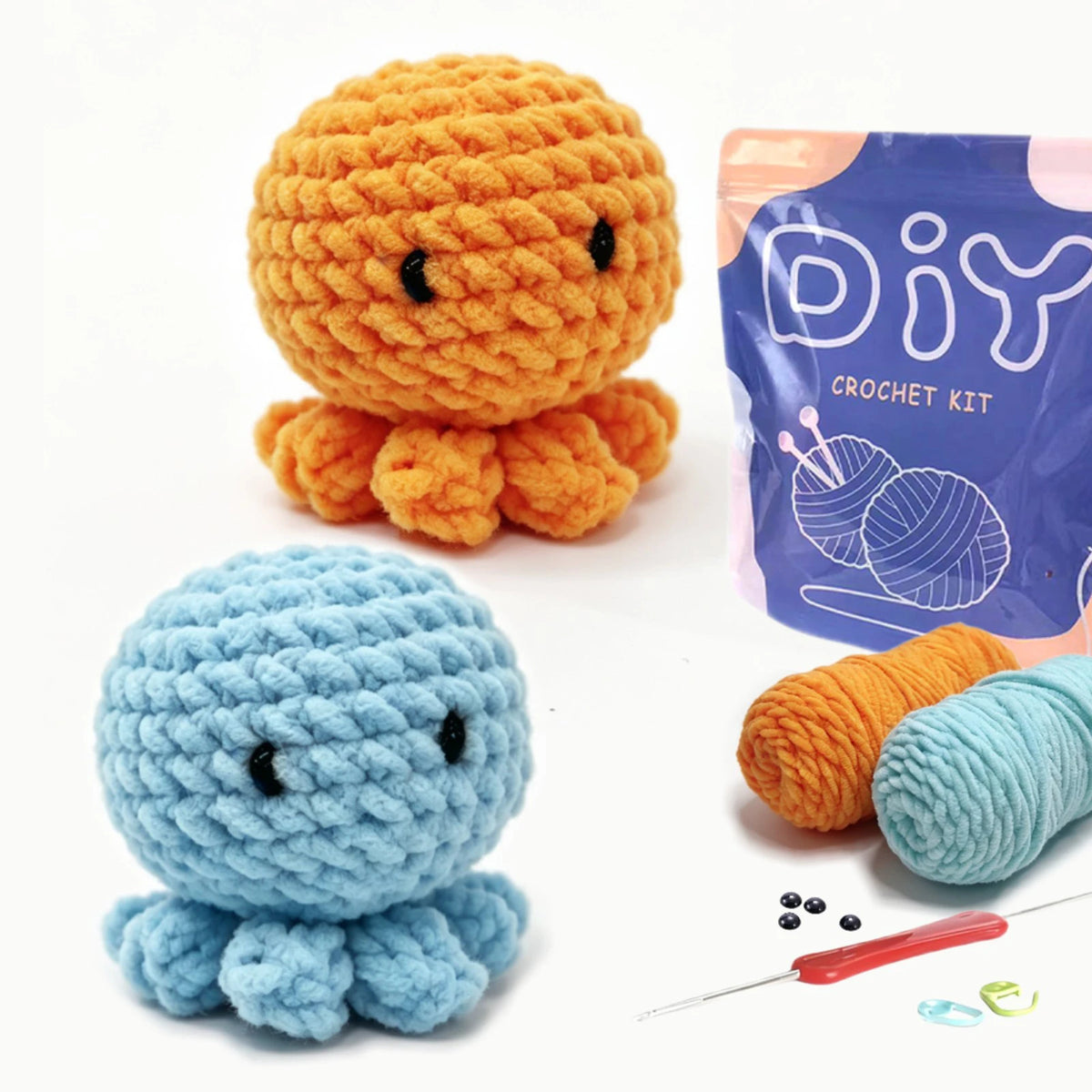 A DIY crochet kit showing a finished orange animal and a light blue plant-like creature with yarn and a needle.
