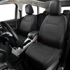 A front seat interior showing a driver's seat and passenger seat with black leather car seat covers.