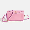 A pink genuine leather square crossbody bag with a gold lock and purple strap.