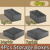 Four gray fabric storage boxes with different grid configurations shown side by side.