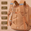 A tan Capybara Kids school backpack showing features like S-shaped shoulder straps, buckled chest, and cushioning.