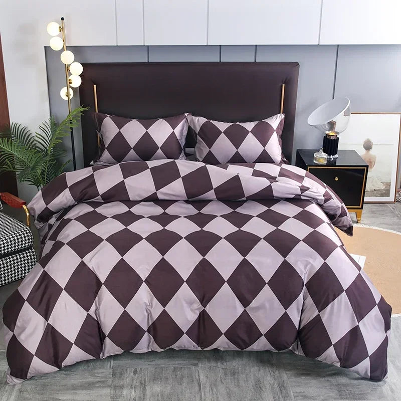 A duvet cover set featuring a geometric diamond pattern in shades of mauve and dark brown on a bed.