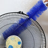 A close-up of a blue bendable fan duster brush with a long handle being used for cleaning.