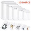 A collection of clear self-sealing jewelry storage bags in various sizes and styles.