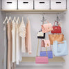 A display of various hanging organizers for hats, bags, and scarves in pastel colors like pink, lavender, and beige.