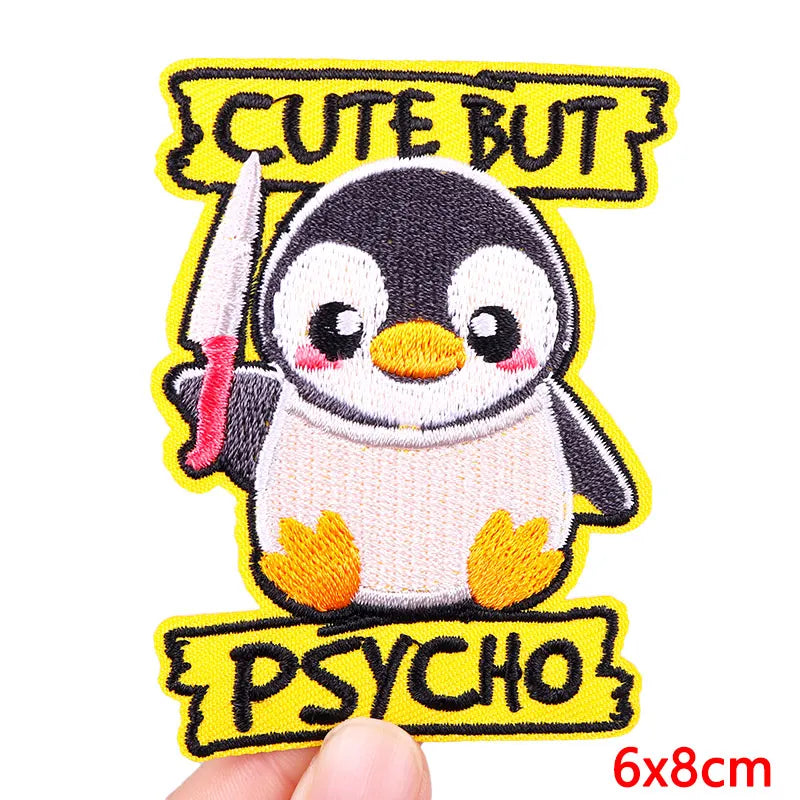 Yellow embroidered patch featuring a cute penguin with text that reads Cute But Psycho