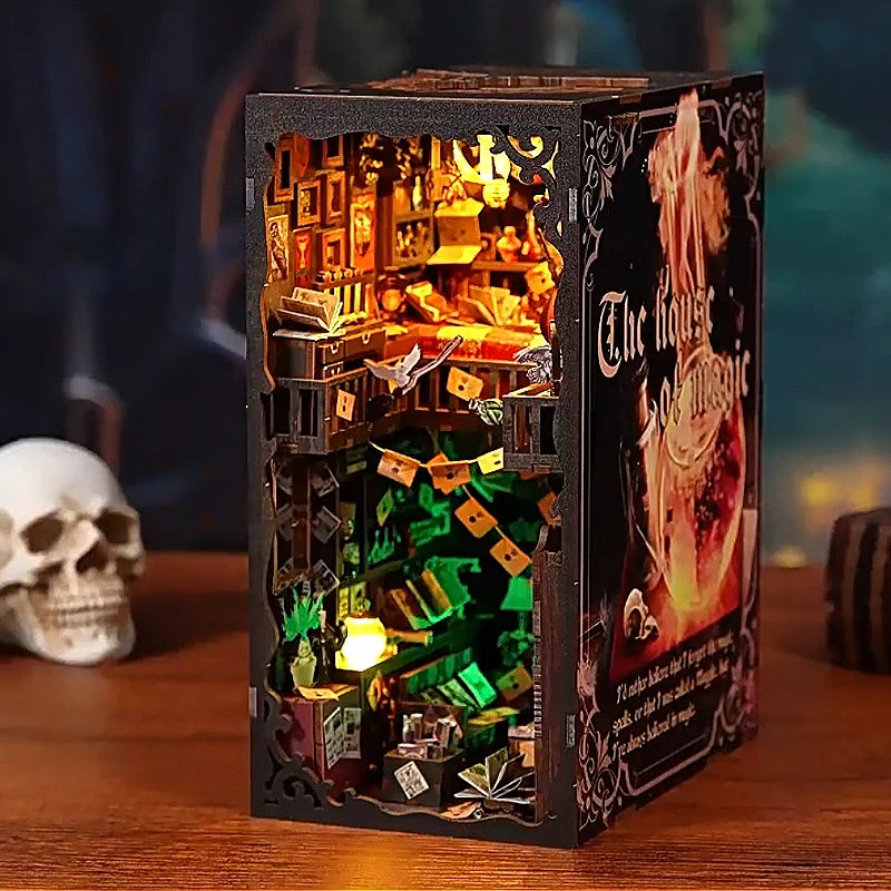 A dark wooden puzzle box featuring a detailed miniature house scene with glowing lights and decorative elements.