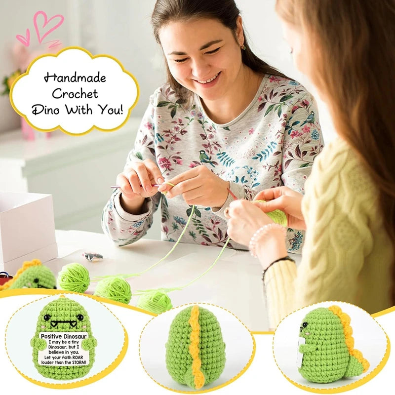 A woman is shown crocheting a dinosaur toy with a positive message card, surrounded by finished green crochet animals.