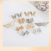 A collection of gold and silver no-sew adjustable waist tighteners for jeans and skirts.
