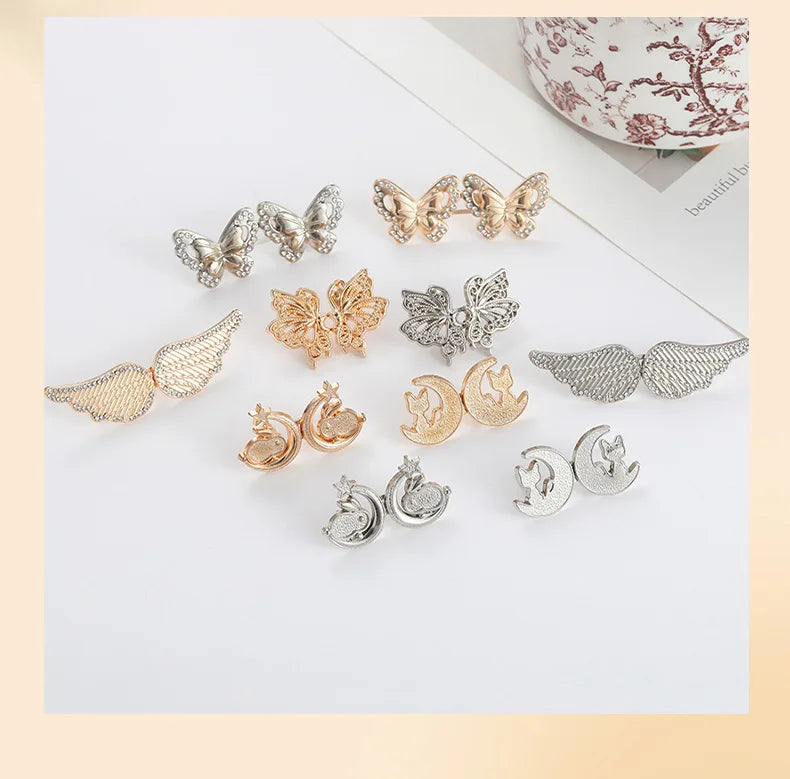 A collection of gold and silver no-sew adjustable waist tighteners for jeans and skirts.