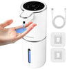 A white touchless automatic soap dispenser is shown being used by a hand, with charging cables and replacement parts displaye