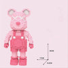 A pink mini angry bear building block set with white accents shown from the front.