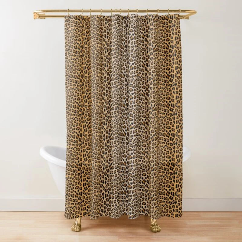 A brown and black leopard print shower curtain hanging from a gold rod.