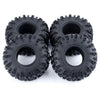 A pair of black mud terrain wheels and tires for RC crawlers.