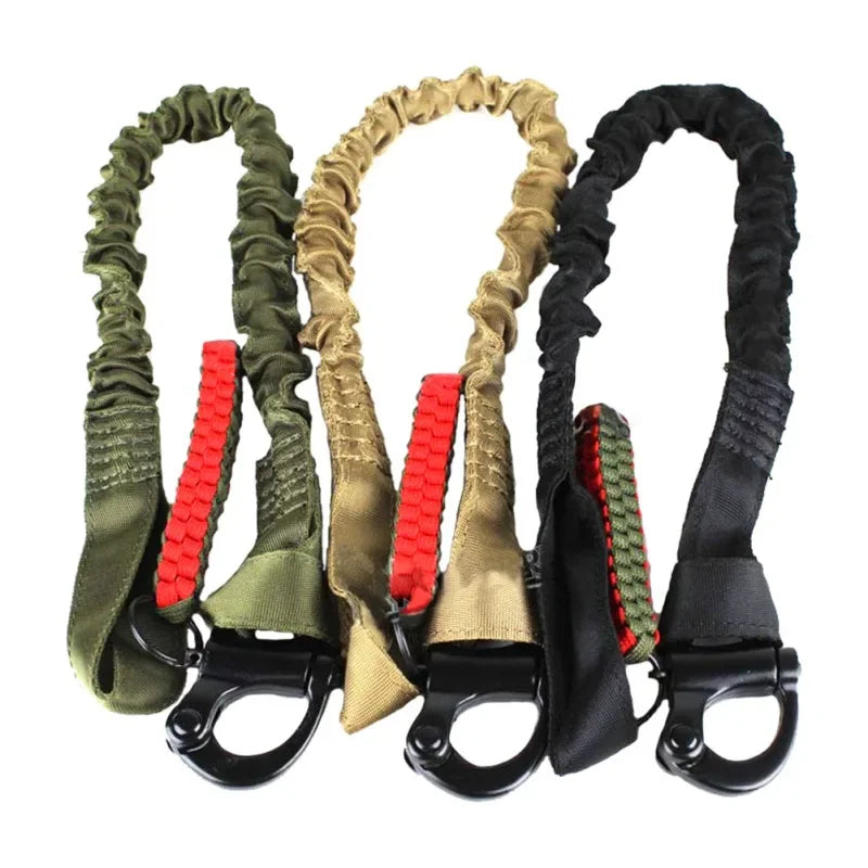 A set of olive green and tan quick-release tactical rifle slings with shoulder pads