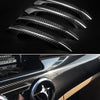 Close-up view of black carbon fiber vinyl wrap film showing various textures and finishes.