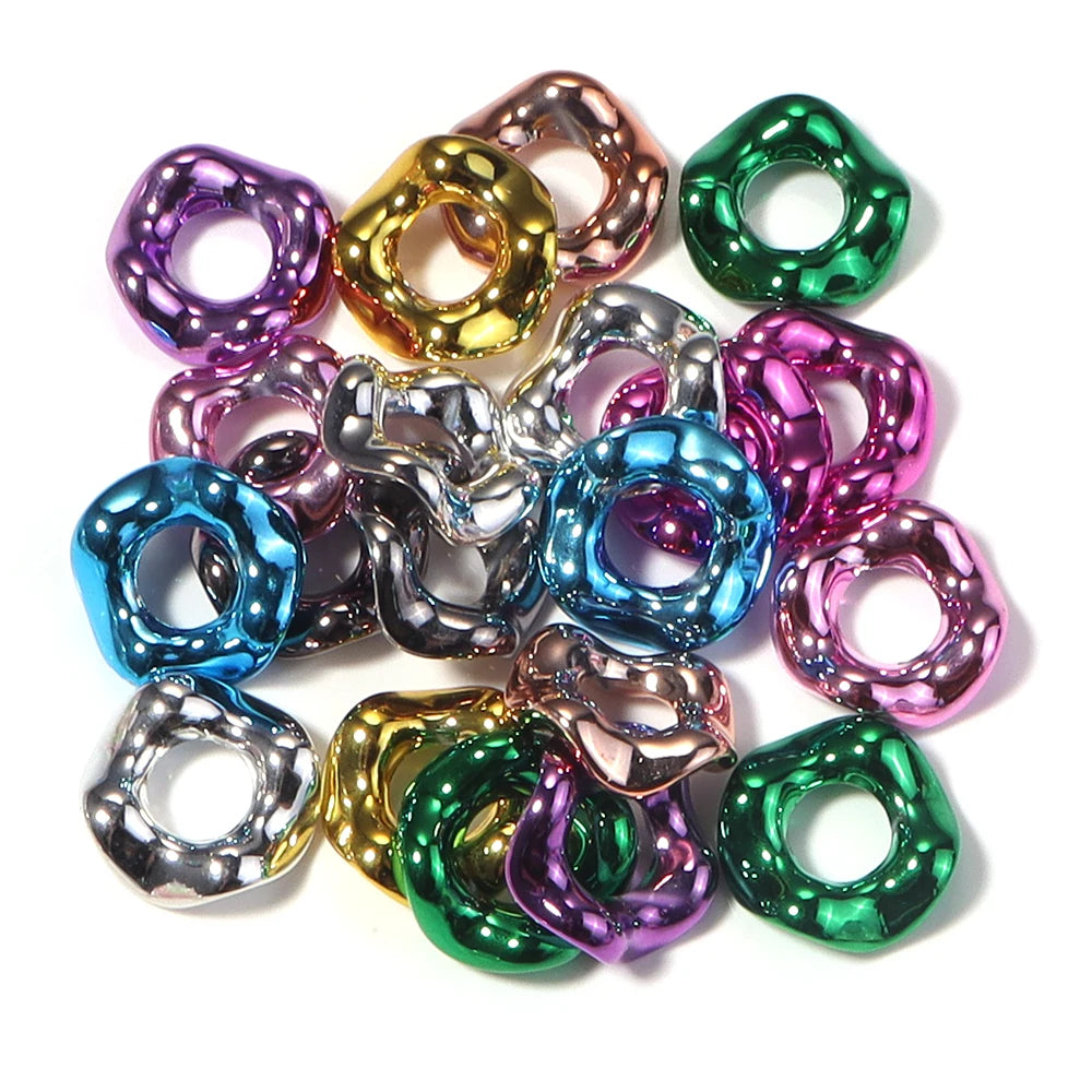 A collection of colorful acrylic spacer beads in a wave pattern for jewelry making
