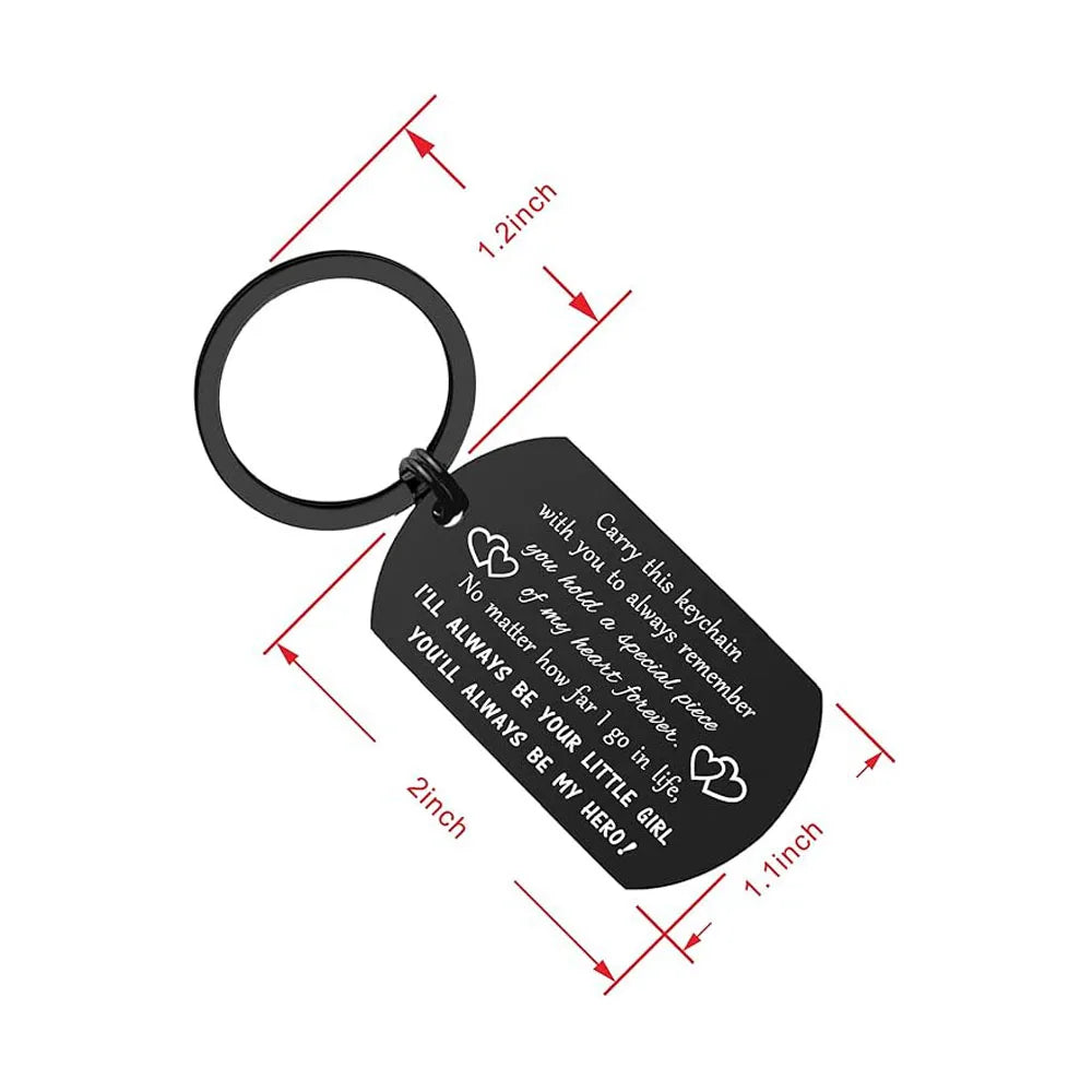 A black drive safe dad keychain with engraved text and a circular keyring.