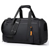 A black large capacity travel duffel bag with padded straps and buckles.
