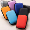 A collection of colorful hard EVA protective cases for a SanDisk Extreme Portable SSD, displayed in various shades.