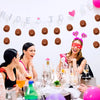 A woman is laughing while surrounded by miniature brown cowboy hats and pink hearts on a white background.