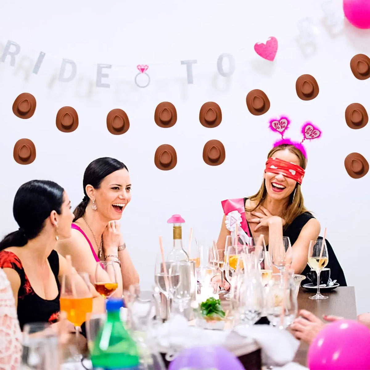 A woman is laughing while surrounded by miniature brown cowboy hats and pink hearts on a white background.