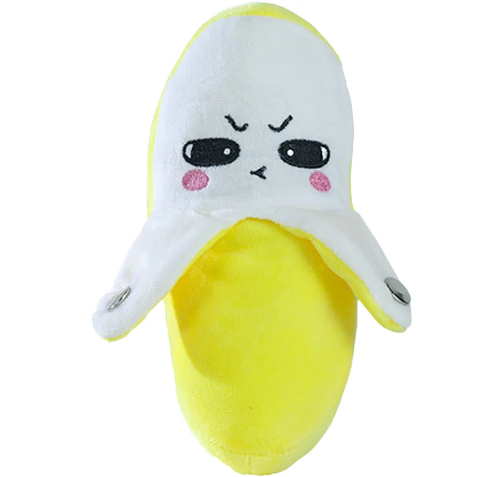 Geloses Spielzeug in Bananenform mit weißer Gesichts und rosa Akzenten.