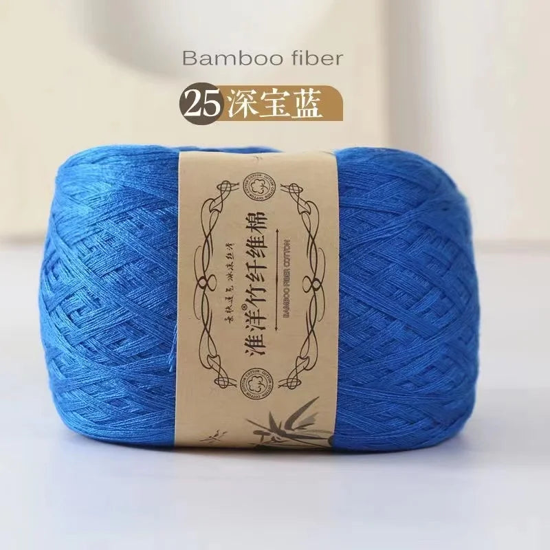 A ball of bright blue bamboo fiber yarn labeled for knitting and crochet