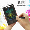 A hand holds a 6.5-inch Mini Color Writing tablet displaying a drawing of a bow and bells on a black screen.