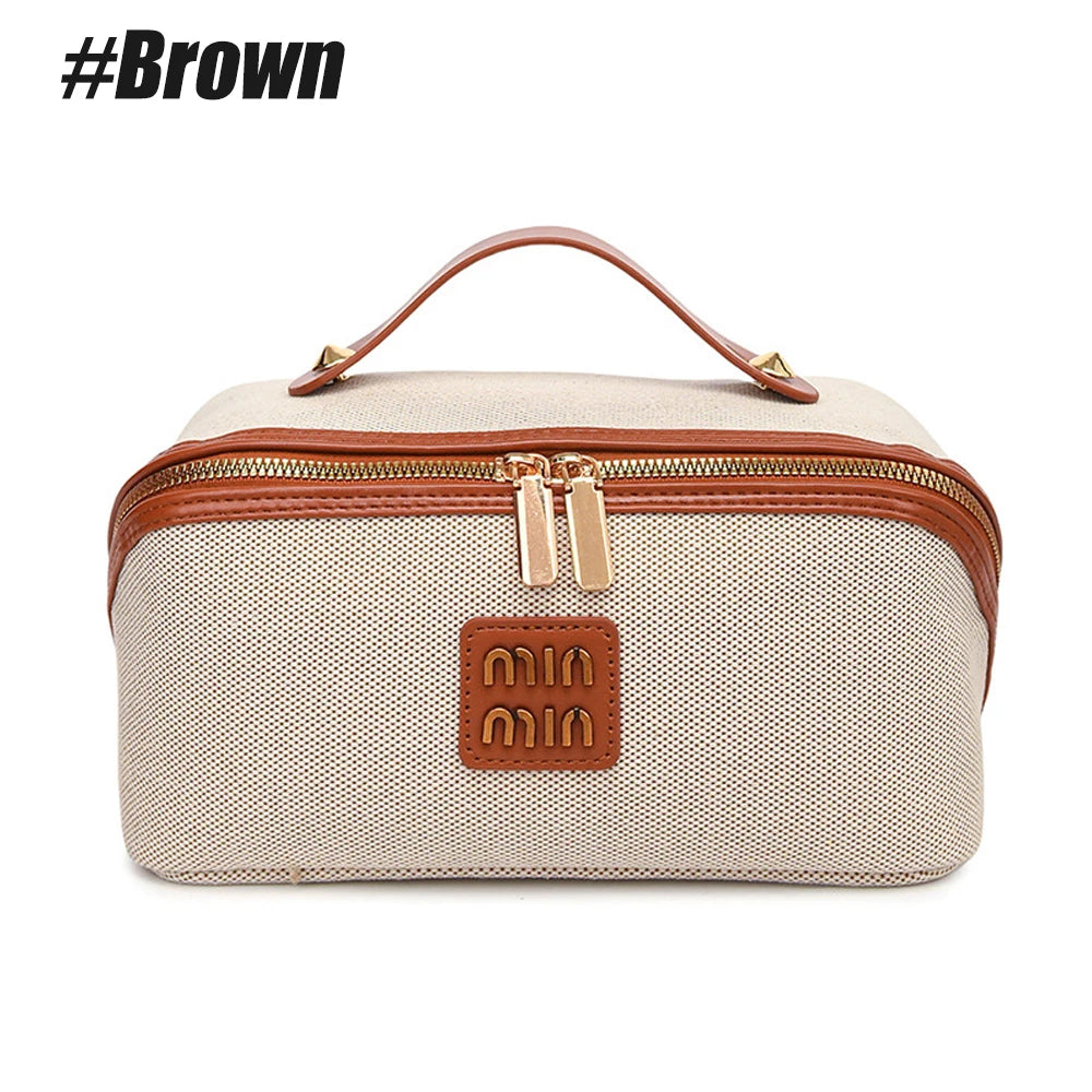 Beige Reise-Make-up-Organizer-Tasche mit braunem Lederbesatz und Tragegriff