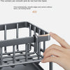 A hand is shown placing a stainless steel sink organizer basket into a drainage tray.