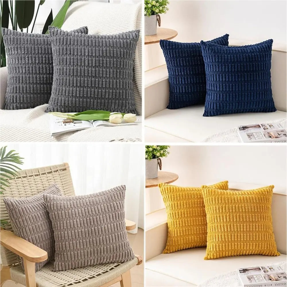 A set of reversible corduroy pillowcases in dark gray and navy blue velvet designs.