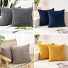 A set of reversible corduroy pillowcases in dark gray and navy blue velvet designs.