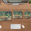 A set of three nature-themed desk mats featuring frogs and plants, displayed on a wooden desk with a laptop.